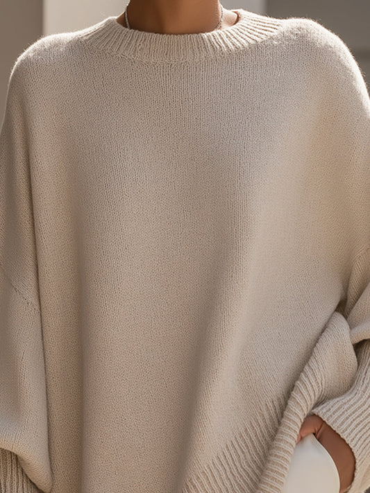 Damski sweter oversized z asymetrycznym dołem