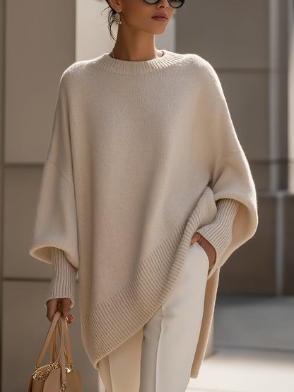 Damski sweter oversized z asymetrycznym dołem