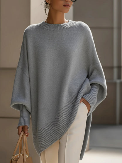Damski sweter oversized z asymetrycznym dołem