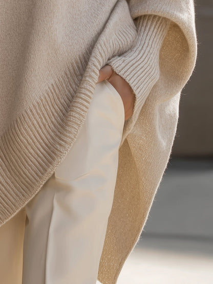 Damski sweter oversized z asymetrycznym dołem